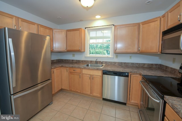 2 Broadale Rd, Doylestown, PA 18901 - kitchen with appliances with stainless steel finishes, light tile patterned floors, light brown cabinets, and dark countertops