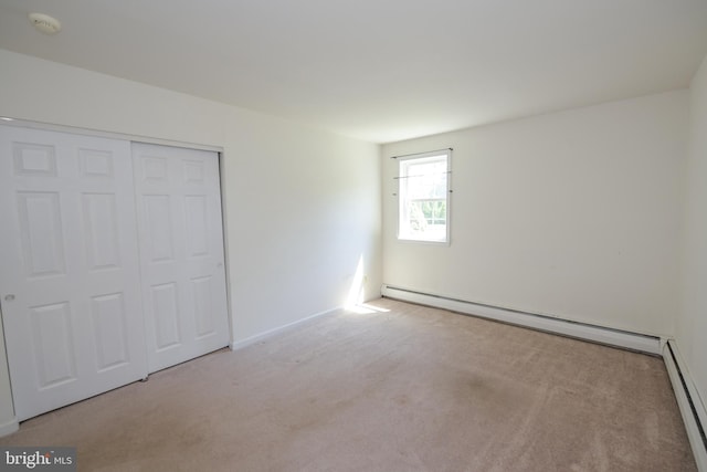 2 Broadale Rd, Doylestown, PA 18901 - unfurnished bedroom with baseboard heating, carpet flooring, a baseboard radiator, and a closet
