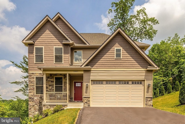 10807 Forest Edge Pl, New Market, MD 21774 - craftsman inspired home with a porch, asphalt driveway, and stone siding