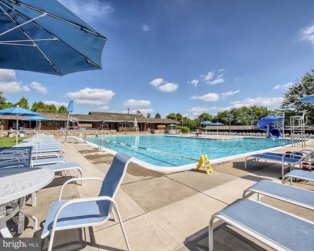 10807 Forest Edge Pl, New Market, MD 21774 - community pool featuring a water slide and a patio