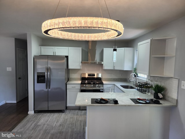 14273 Princedale Dr, Woodbridge, VA 22193 - kitchen with appliances with stainless steel finishes, wall chimney exhaust hood, open shelves, light wood-type flooring, and decorative backsplash