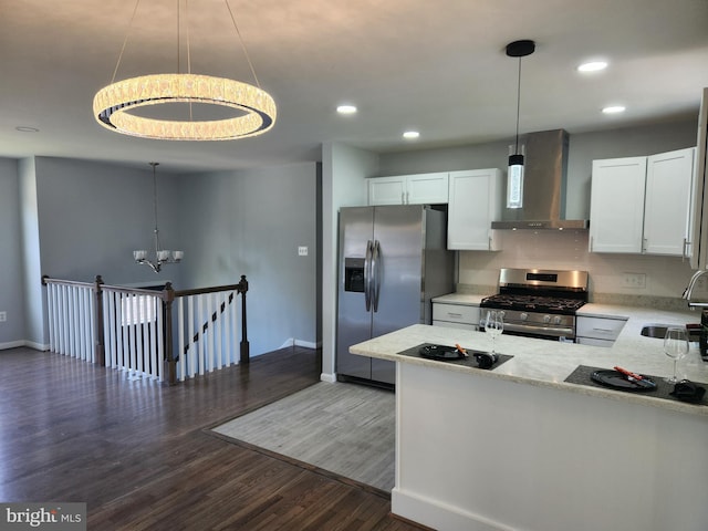 14273 Princedale Dr, Woodbridge, VA 22193 - kitchen with wall chimney range hood, stainless steel appliances, a chandelier, recessed lighting, and dark wood finished floors