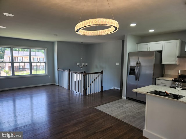 14273 Princedale Dr, Woodbridge, VA 22193 - kitchen with a chandelier, stainless steel appliances, recessed lighting, dark wood finished floors, and white cabinetry