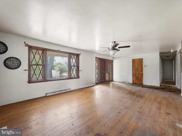 46 Harrow Pl, Charles Town, WV 25414 - unfurnished living room with baseboard heating, hardwood / wood-style floors, and ceiling fan