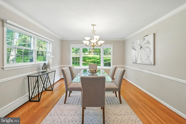 508 Vierling Dr, Silver Spring, MD 20904 - dining space with a chandelier, a baseboard heating unit, light wood-style flooring, and ornamental molding