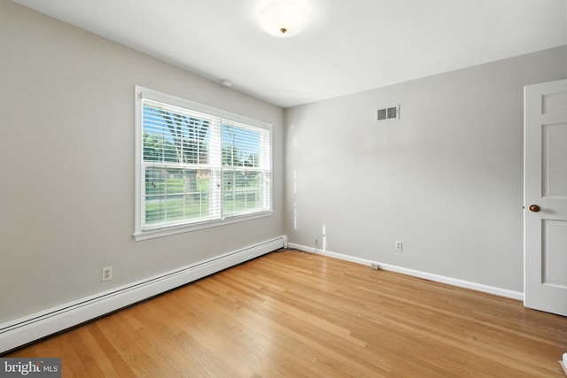 508 Vierling Dr, Silver Spring, MD 20904 - unfurnished room featuring a baseboard radiator and light wood-style floors