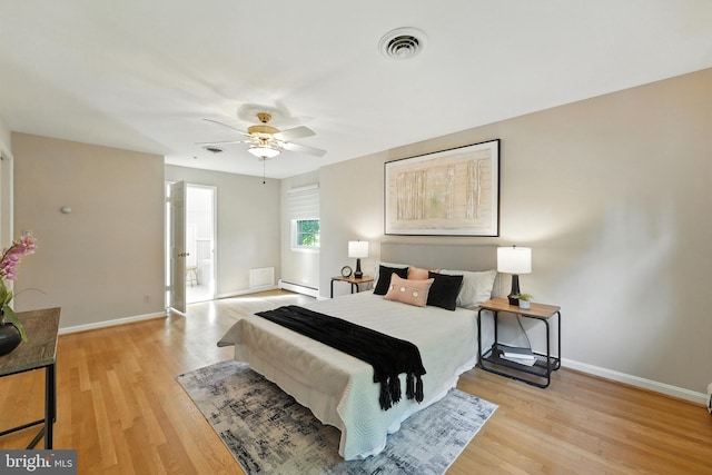 508 Vierling Dr, Silver Spring, MD 20904 - bedroom with light wood-type flooring, a baseboard radiator, and a ceiling fan