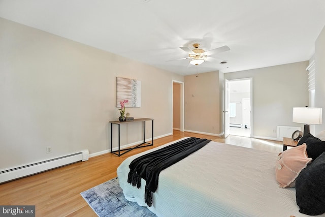 508 Vierling Dr, Silver Spring, MD 20904 - bedroom with wood finished floors, baseboard heating, and ceiling fan