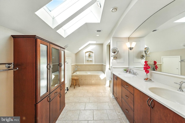 508 Vierling Dr, Silver Spring, MD 20904 - full bath featuring a skylight, a bath, double vanity, vaulted ceiling, and tile patterned floors