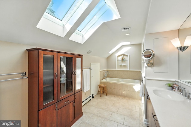 508 Vierling Dr, Silver Spring, MD 20904 - bathroom with a skylight, a garden tub, vanity, vaulted ceiling, and tile patterned floors