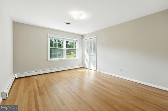 508 Vierling Dr, Silver Spring, MD 20904 - empty room with baseboard heating and light wood finished floors