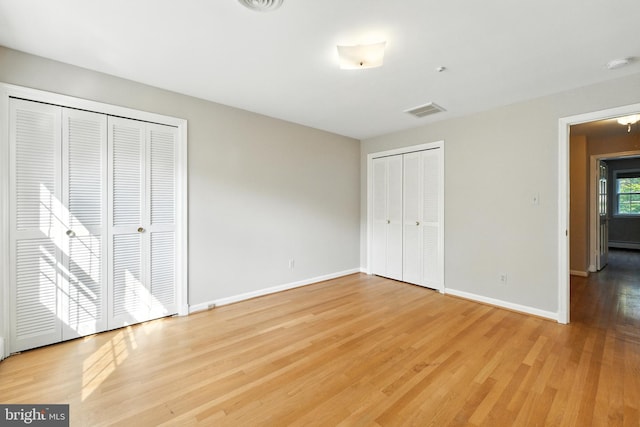 508 Vierling Dr, Silver Spring, MD 20904 - unfurnished bedroom featuring multiple closets and light wood-type flooring