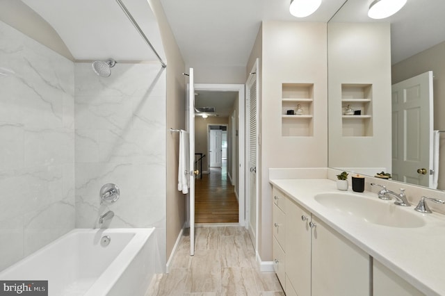 508 Vierling Dr, Silver Spring, MD 20904 - bathroom featuring vanity, shower / bathtub combination, built in shelves, and marble look tiles