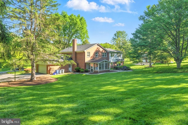508 Vierling Dr, Silver Spring, MD 20904 - view of front facade with driveway, a chimney, a front yard, and covered porch