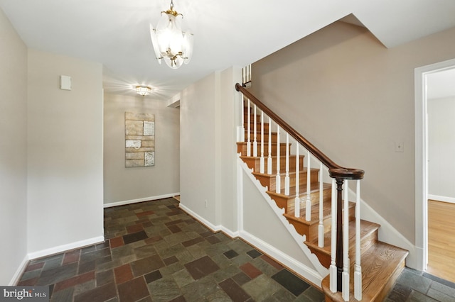 508 Vierling Dr, Silver Spring, MD 20904 - stairway with stone tile flooring and a chandelier