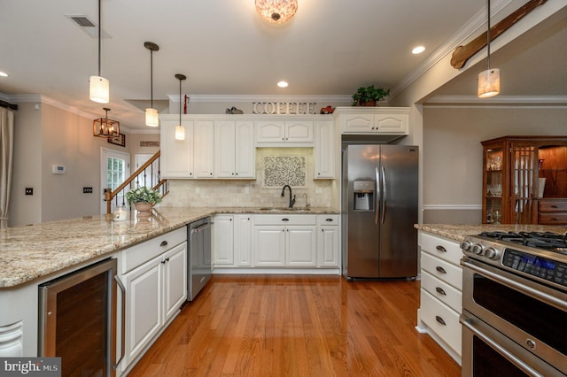 12 Deerpath Ln, Columbus, NJ 08022 - kitchen with stainless steel appliances, beverage cooler, white cabinetry, a peninsula, and pendant lighting