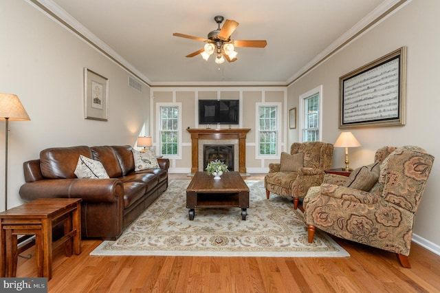 12 Deerpath Ln, Columbus, NJ 08022 - living room featuring a ceiling fan, crown molding, wood finished floors, and a fireplace