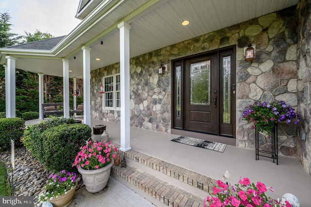 12 Deerpath Ln, Columbus, NJ 08022 - property entrance with stone siding, a porch, and a shingled roof