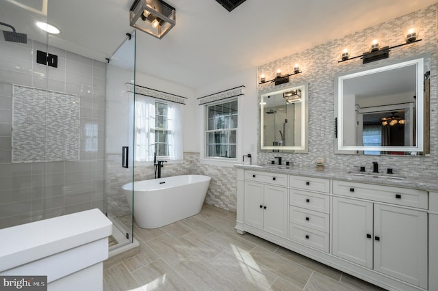 12 Deerpath Ln, Columbus, NJ 08022 - full bathroom with tile walls, a stall shower, double vanity, and a freestanding tub