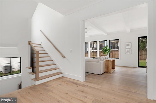 2724 N Dinwiddie St, Arlington, VA 22207 - staircase featuring wood finished floors and beam ceiling