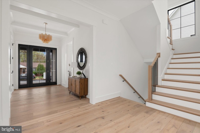 2724 N Dinwiddie St, Arlington, VA 22207 - entrance foyer with light wood-type flooring, a chandelier, and stairway