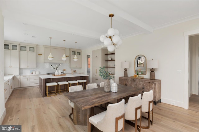 2724 N Dinwiddie St, Arlington, VA 22207 - dining space featuring light wood-style flooring, a chandelier, beam ceiling, and crown molding