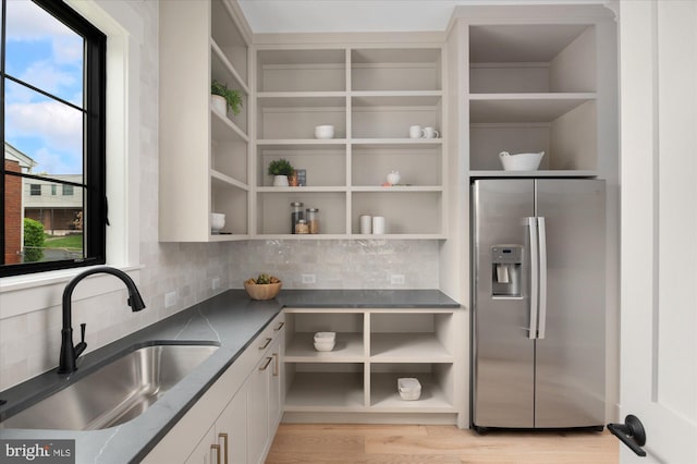 2724 N Dinwiddie St, Arlington, VA 22207 - kitchen featuring stainless steel fridge, open shelves, and tasteful backsplash