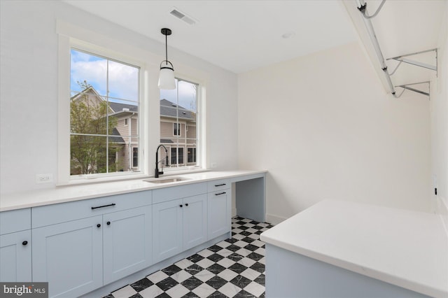 2724 N Dinwiddie St, Arlington, VA 22207 - kitchen with light flooring, hanging light fixtures, and light countertops