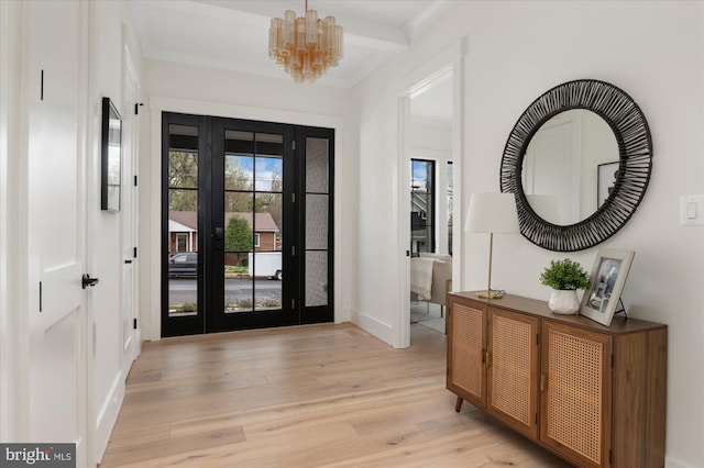 2724 N Dinwiddie St, Arlington, VA 22207 - entrance foyer with light wood-type flooring, a chandelier, and beam ceiling