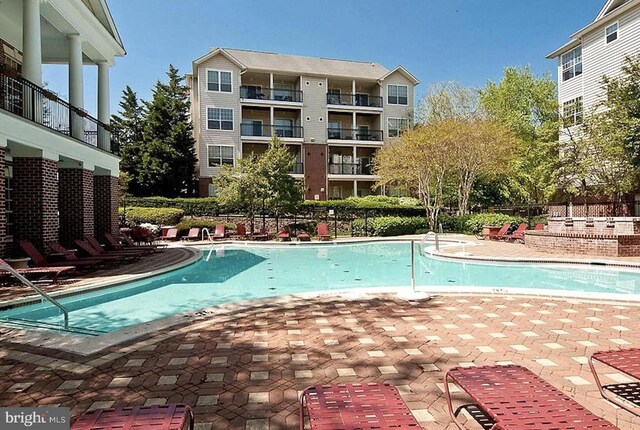 1571 Spring Gate Dr Unit 6314, Mclean, VA 22102 - community pool featuring a patio