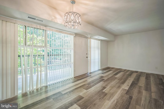 4939 Americana Dr Unit 106, Annandale, VA 22003 - unfurnished dining area with a chandelier and wood finished floors