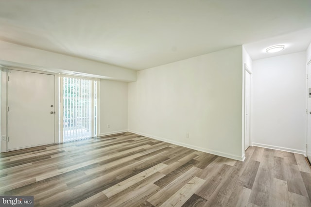 4939 Americana Dr Unit 106, Annandale, VA 22003 - unfurnished room with wood finished floors and baseboards