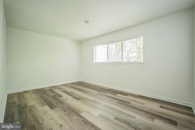 4939 Americana Dr Unit 106, Annandale, VA 22003 - empty room with wood finished floors and a smoke detector