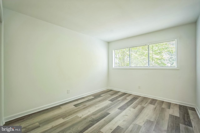 4939 Americana Dr Unit 106, Annandale, VA 22003 - unfurnished room featuring wood finished floors and baseboards