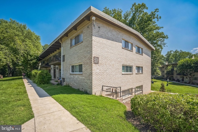4939 Americana Dr Unit 106, Annandale, VA 22003 - view of home's exterior with a lawn and brick siding