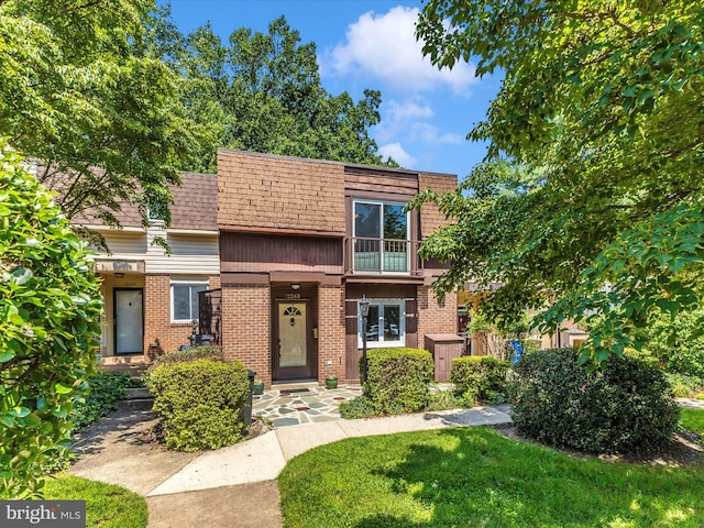 12263 Greenleaf Ave, Potomac, MD 20854 - multi unit property featuring brick siding, a front lawn, french doors, and roof with shingles