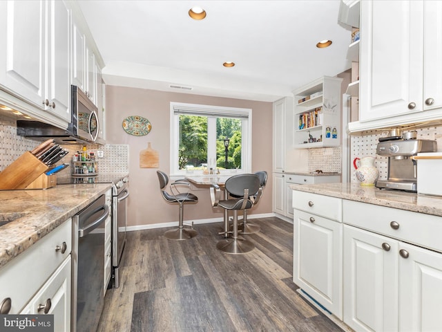 12263 Greenleaf Ave, Potomac, MD 20854 - kitchen with stainless steel appliances, white cabinets, dark wood-style flooring, backsplash, and recessed lighting
