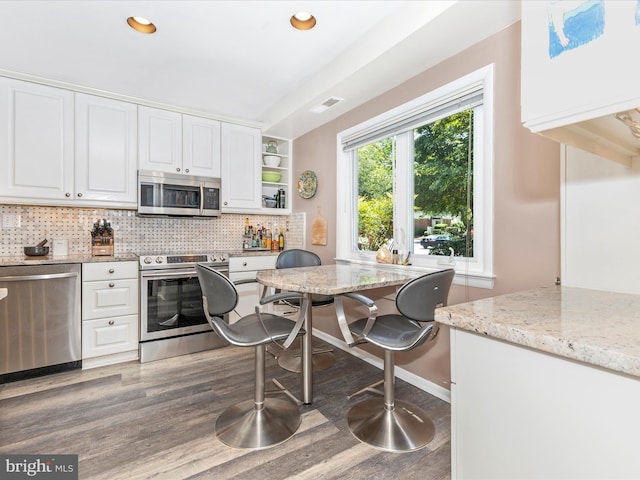 12263 Greenleaf Ave, Potomac, MD 20854 - kitchen with appliances with stainless steel finishes, white cabinets, wood finished floors, and recessed lighting