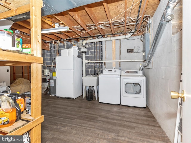 12263 Greenleaf Ave, Potomac, MD 20854 - unfinished basement featuring freestanding refrigerator, independent washer and dryer, electric water heater, and wood finished floors