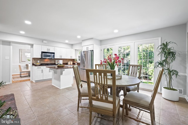 906 Danton Ln, Alexandria, VA 22308 - dining room featuring plenty of natural light, recessed lighting, and light tile patterned flooring