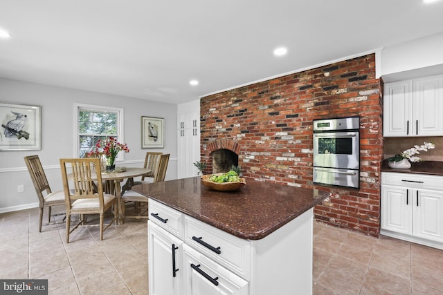 906 Danton Ln, Alexandria, VA 22308 - kitchen featuring oven, a warming drawer, recessed lighting, a kitchen island, and light tile patterned floors
