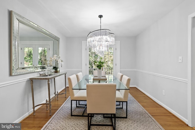 906 Danton Ln, Alexandria, VA 22308 - dining area featuring wood finished floors and a chandelier