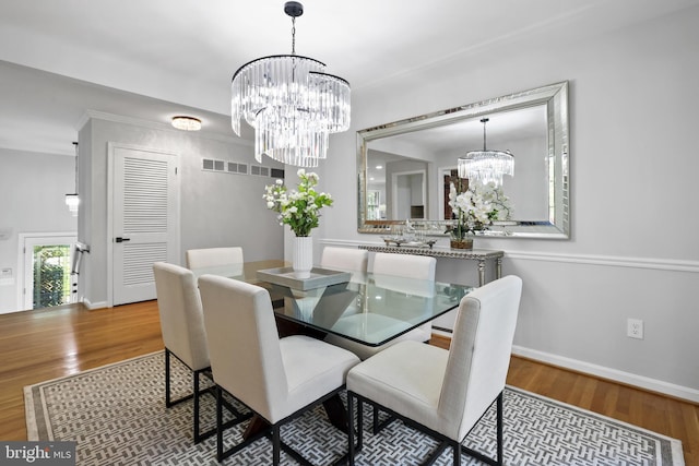 906 Danton Ln, Alexandria, VA 22308 - dining space with a chandelier and wood finished floors