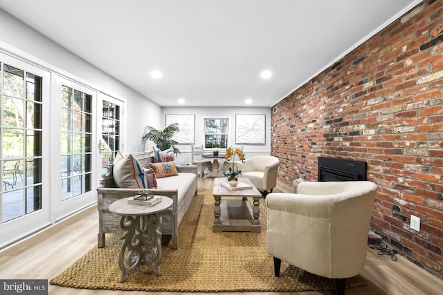 906 Danton Ln, Alexandria, VA 22308 - living room featuring wood finished floors, recessed lighting, and brick wall