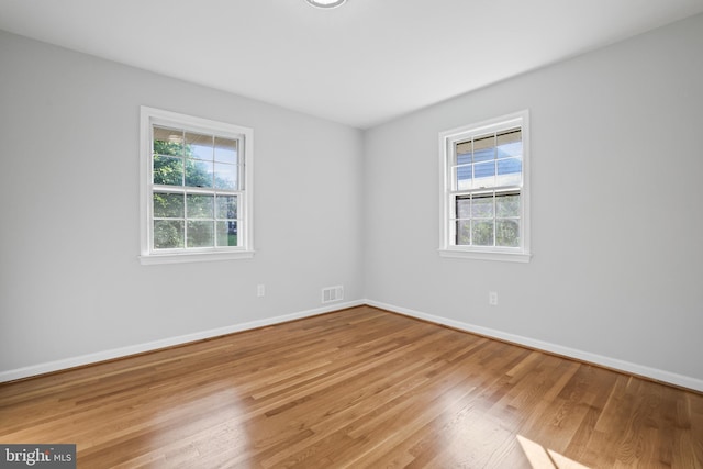 906 Danton Ln, Alexandria, VA 22308 - empty room featuring healthy amount of natural light and light wood-style floors