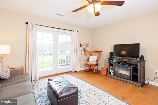 1338 Chami Dr Unit 196, Spring Grove, PA 17362 - living area with wood finished floors, plenty of natural light, and a ceiling fan