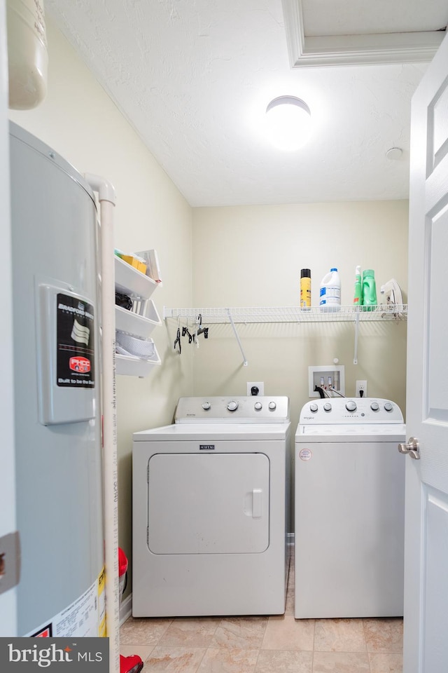 1338 Chami Dr Unit 196, Spring Grove, PA 17362 - laundry area featuring water heater, washing machine and dryer, and light tile patterned floors