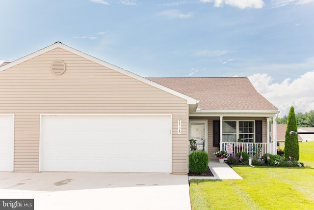 1338 Chami Dr Unit 196, Spring Grove, PA 17362 - view of front of house with a porch, driveway, a front lawn, a garage, and roof with shingles