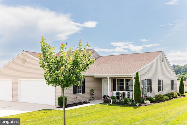 1338 Chami Dr Unit 196, Spring Grove, PA 17362 - view of front of home with covered porch, a garage, concrete driveway, and a front yard