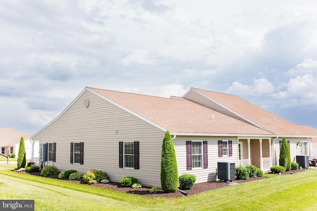 1338 Chami Dr Unit 196, Spring Grove, PA 17362 - back of house featuring a lawn and roof with shingles